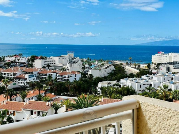 Apartment for Sale in Costa Adeje, Tenerife South Explore this stunning flat for sale in Costa Adeje, Las Américas. Features 1 bedroom, terrace with sea views, communal pool, and prime location near the beach.