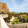 2-bedroom apartment For Sale in Los Cristianos, Tenerife, featuring a 110 m² private terrace, ocean views, and a communal pool. Perfect for living or investing!